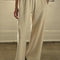 model wearing naturel wide leg pants with side inlets