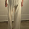 back view of model wearing naturel wide leg pants with side inlets