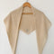 oatmeal cashmere shawl on a hanger