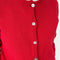 up close of model wearing buttoned chili red cotton cardigan