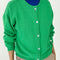 model wearing buttoned spring green cotton cardigan