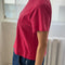 side view of model wearing red pepper darling tee