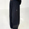 side view of model wearing black cotton wide leg pants with side inlets
