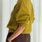 side view of model wearing mohair bistro yellow pull over sweater