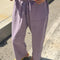 model wearing dried lavender carpenter cotton pants