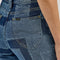 up close of back pocket of denim patchwork flared jeans