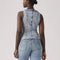 back view of model wearing acid washed peplum tank top with several inlets