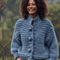 model wearing dusky blue oversized knit cardigan with oversized buttons