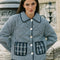 model wearing blue checkered jacket with blue plaid front patch pockets and collar