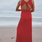 back view of model wearing pepper red crinkle tank maxi dress with open tie back