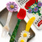set of three colorful wildflower acetate cutlery utensils with matching tin holder