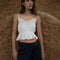 white gathered cropped tank with ruffle bust and tie waist