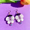 purple pansy dangle earrings with a pretty bead on the bottom