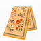 yellow tea towel with colorful folk floral print
