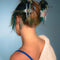 model wearing blue iridescent star shaped hair claws