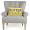 rectangular yellow butter throw pillow on a chair