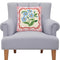 pink gingham throw pillow with blue forget me not flowers on a chair