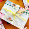 decorated present with wrapping paper, lace and ribbon