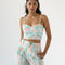 model wearing pastel wavy print bustier tank and matching bottoms