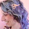 model wearing pink stork scissors hair clip