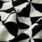 up close of black and white geometric hand towel