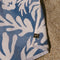 side view of cream and dusty blue abstract palm tree and sun design turkish towel
