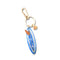 blue surfboard key charm with gold hardware
