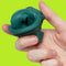 model holding forest green fidget putty