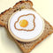 completed egg cross stitch kit on bread