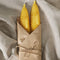 wrapped set of two yellow fish shaped taper candles