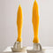 set of two yellow fish shaped taper candles in candleholders