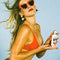 model holding 1.4 oz mini classic whip spf 30 sunscreen