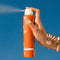 model spraying 5 fl oz spray oil orange gelee sunscreen spray