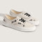 cream authentic sneakers with black embroidered floral and checkered pattern
