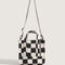 backview of black and white checkered small tote bag with white adjustable strap