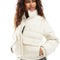 model wearing cream cropped puffer jacket
