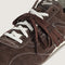 up close of brown vans super low pro trainer sneakers with white and brown laces