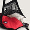 black mesh market bag with beach items inside