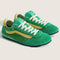green super low pro sneakers with vibrant yellow stripe and trim