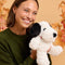 model holding snoopy warmie plush