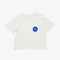 white box tee with a patch pocket with a blue circle design and the words i choose a state of calm