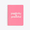 bright pink notebook with the words positivity is powerful on the cover