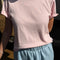 model wearing baby pink tee