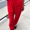 model wearing red cotton balloon pants

