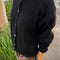 side view of model wearing black mohair button up cardigan