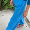 side view of model wearing french blue cotton balloon pants
