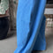 model wearing french blue draped relaxed fit pants