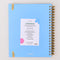 back view of blue large 17-month planner with white 'good things ahead' and gold metallic elastic closure