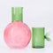 separated pink cherry shaped carafe with green lid/cup with leaf detail 
