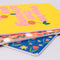 set of three notebook set: dark blue with tulip print, yellow with 'you're the cherry on top' typography, and pink mid century tulips stacked to show thickness